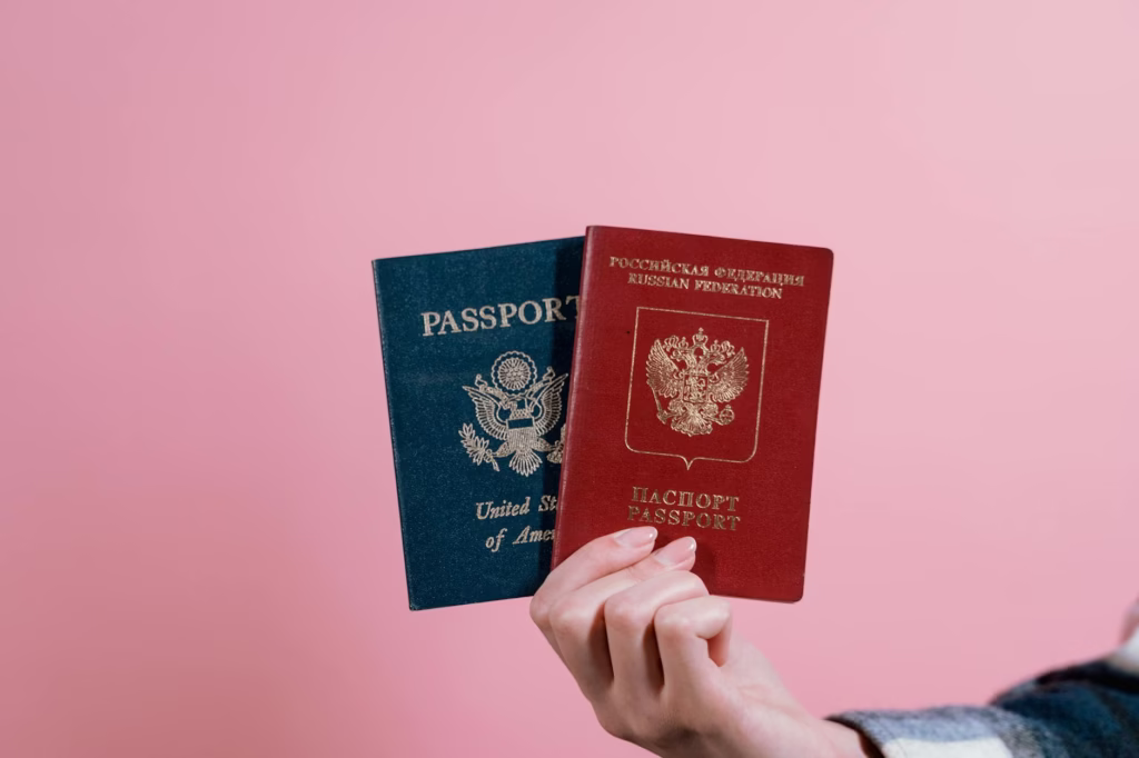 H1B News: $100K Visa Fee Reshapes U.S. Tech Hiring 1 person holding red and blue book
